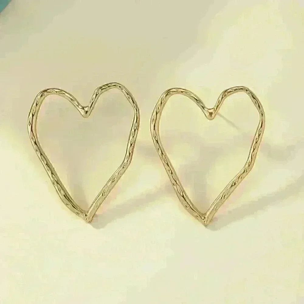 Hollow Heart Shaped Stud Earrings - Picture 4 of 5